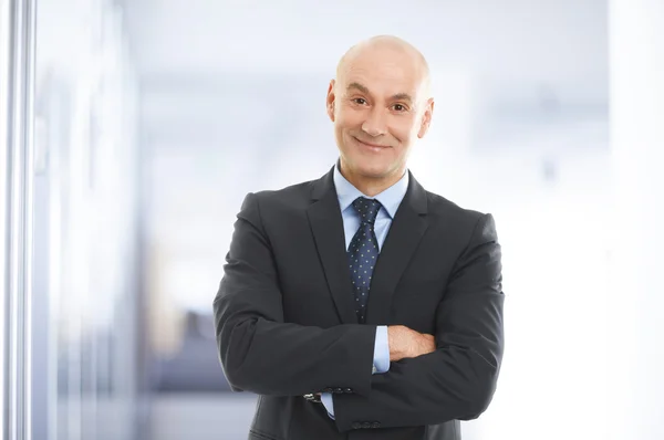 Businessman standing at office — Stock Photo, Image