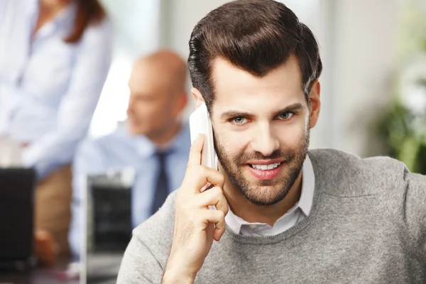 Professional man at office using mobile — Stock Photo, Image