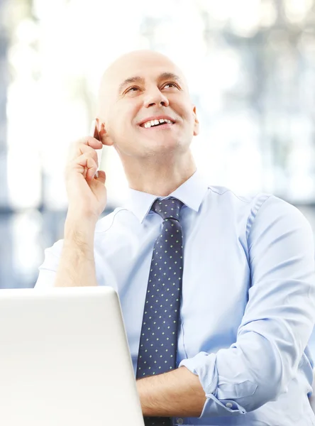 Executive senior man sitting at office — стоковое фото