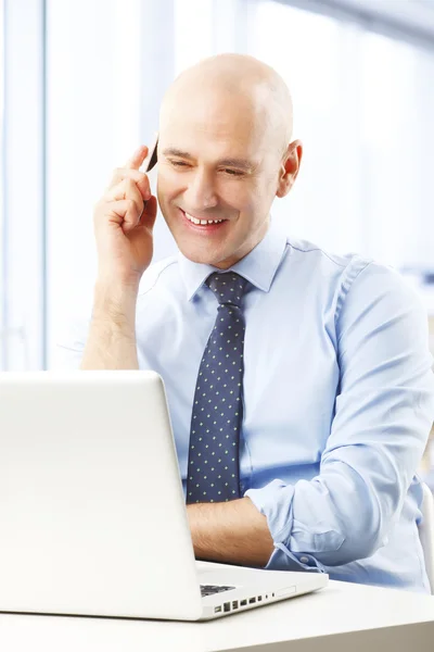 Businessman sitting at office — Stock Photo, Image