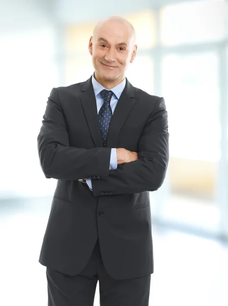 Senior businessman standing at office — Stock Photo, Image