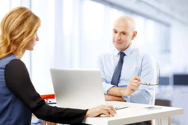 Businessman against businesswoman at job interview — Stock Photo, Image