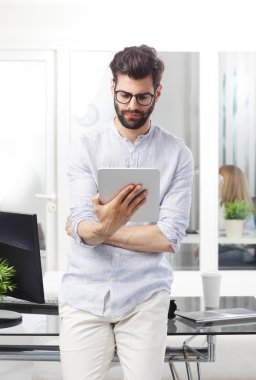 professional man holding digital tablet