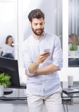 professional at office using mobile