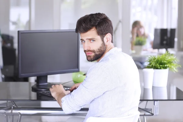 Professional sitting at design studio — Stock Photo, Image