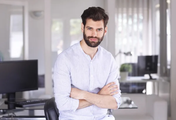 Young assistant with arms crossed — Stok fotoğraf