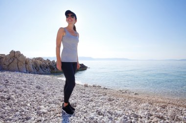 woman on beach after morning running