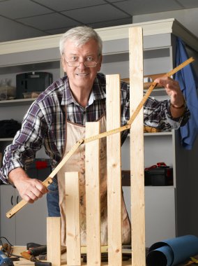 carpenter making graph from wood