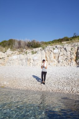 woman relaxing on beach after workout