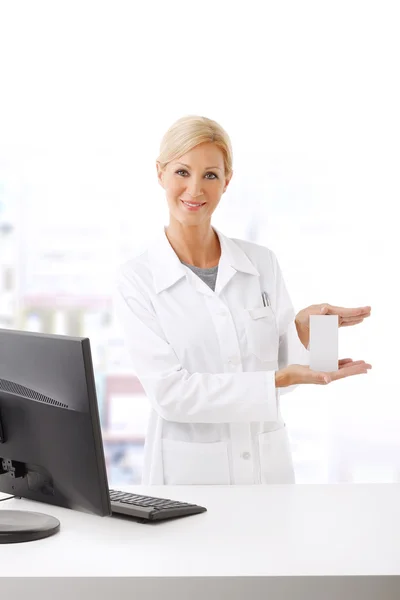 Pharmacist in front of computer working — 스톡 사진