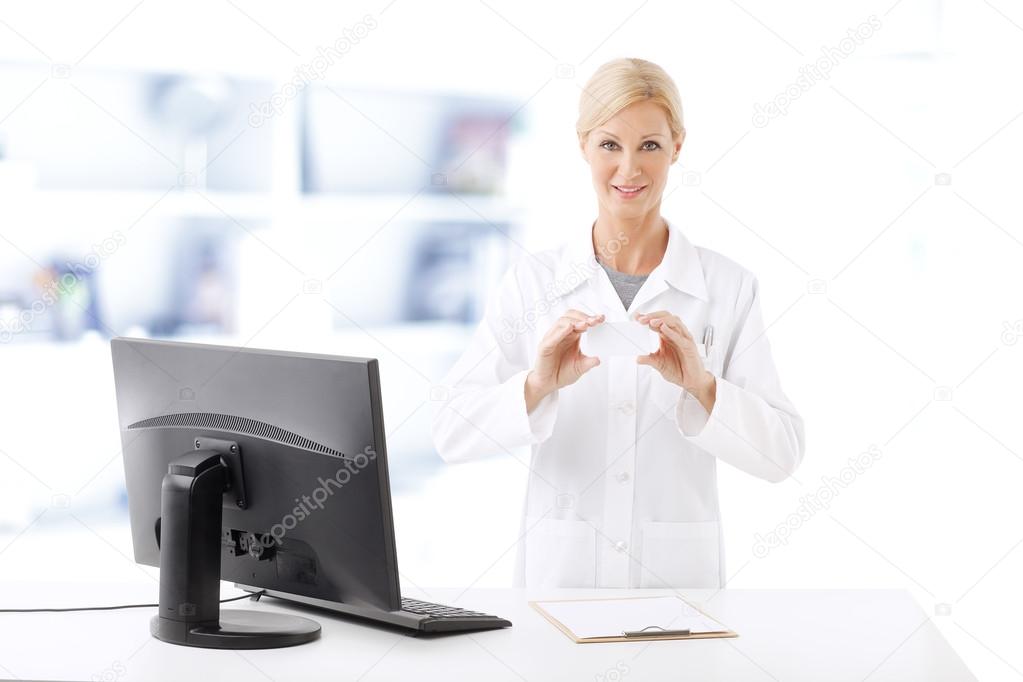 pharmacist in front of computer working