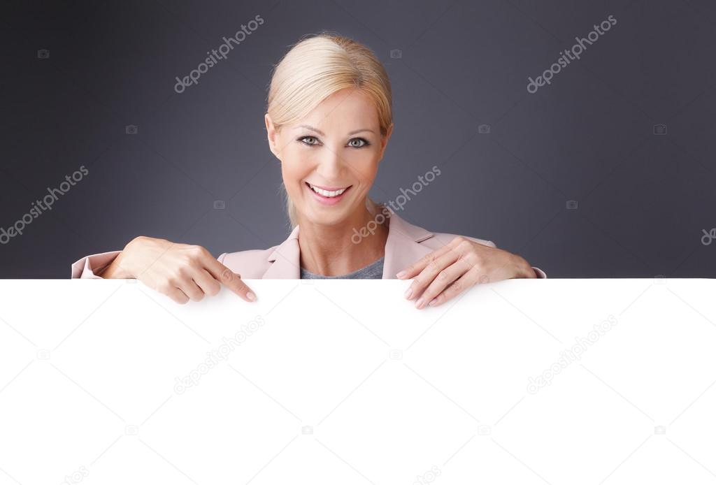 businesswoman holding a blank billboard