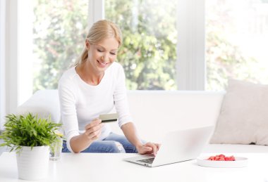woman  in front of laptop shopping online