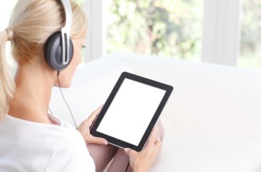 female with headphone at home
