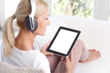 female with headphone at home