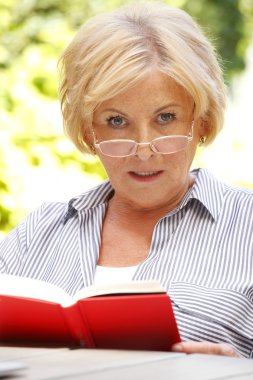 senior woman enjoying good book