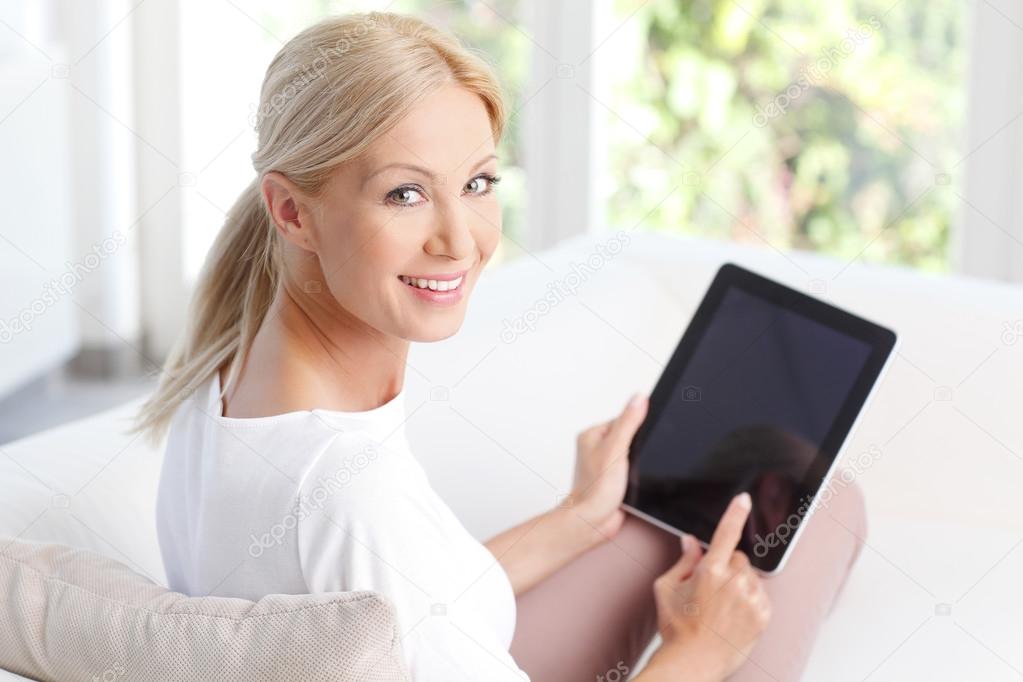 woman holding digital tablet