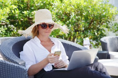 woman reading emails on her phone