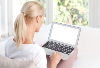 woman using blank screen laptop