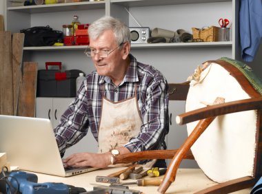 manual worker in workshop making online order