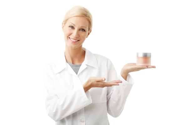 Beauty specialist holding cream jar — Stock Photo, Image