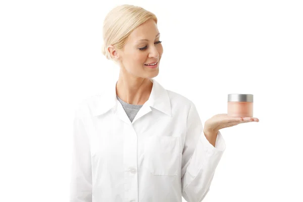 Beauty specialist holding cream jar — Zdjęcie stockowe