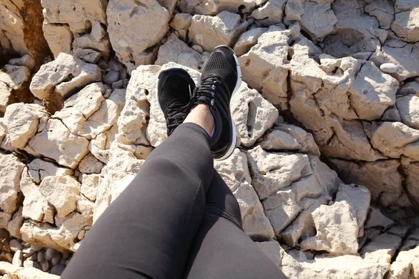 Woman leg while relaxing on beach — 스톡 사진