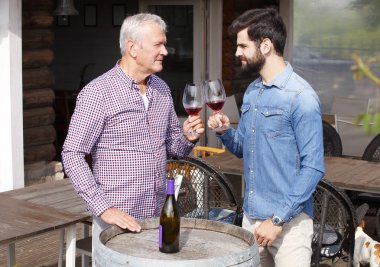 winemakers in front of wine cellar and consulting