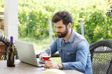 winemaker sitting at wine cellar