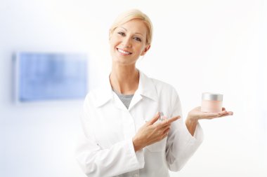 assistant holding in her hand a jar