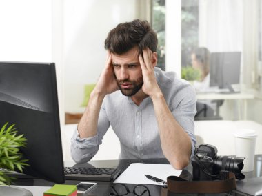 care-worn businessman thinking