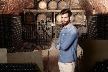 winemaker standing in  cellar