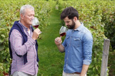 winemakers smelling a glasses