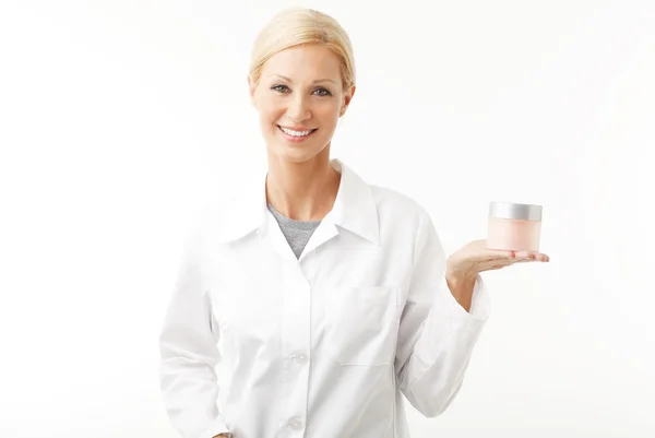 Therapist holding a cream jar — Stockfoto