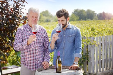 sommelier and  winemaker tasting  wine
