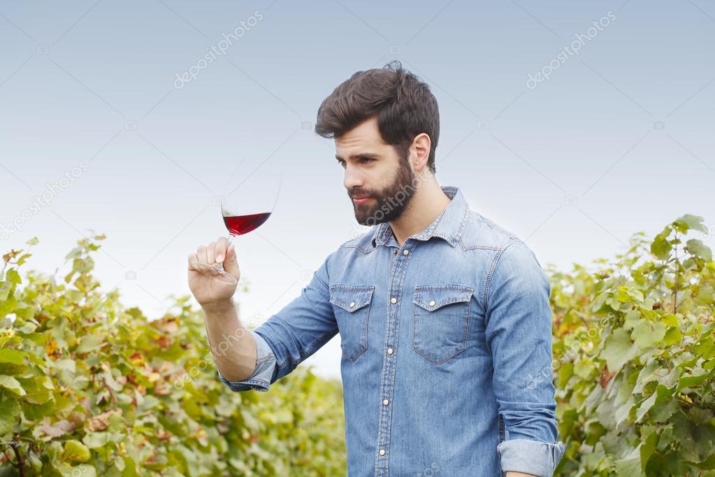 winemaker holding  a glass