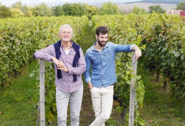 winemakers  standing  and consulting