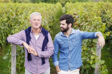 winemakers  standing  and consulting