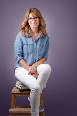 smiling middle age woman sitting