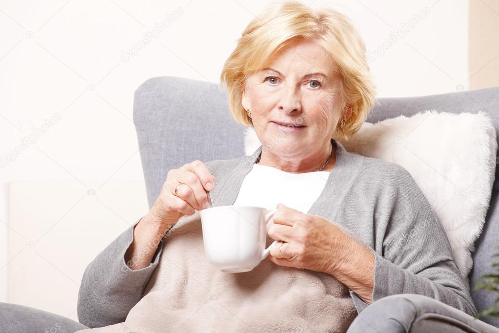 Senior woman holding cup