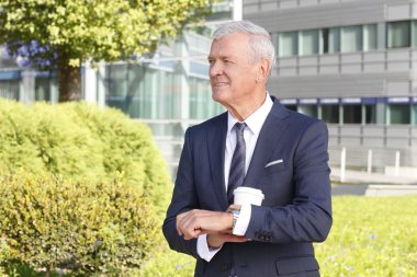 Senior manager checking the time