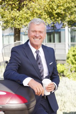 businessman standing at business park