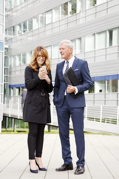 Businesswoman holding phone — Stock Photo, Image