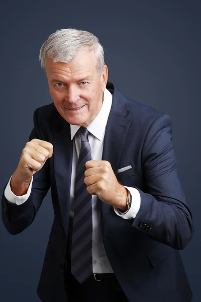 Man with puching fists — Stockfoto