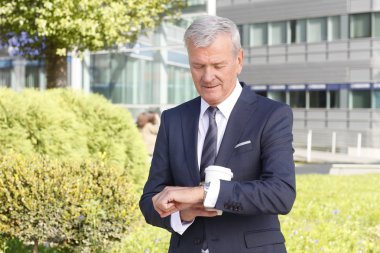 manager standing at office building