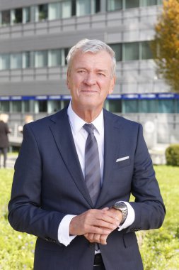 manager standing at office building