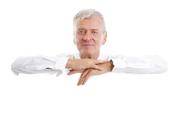 Hombre de negocios con letrero blanco en blanco — Foto de Stock