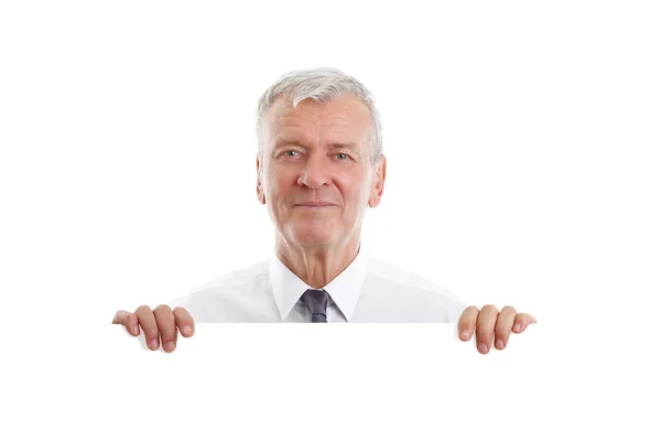 Businessman holding  blank white signboard — Stock fotografie