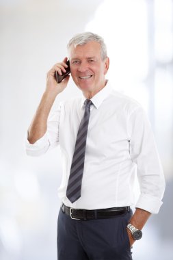 Senior businessman making kall