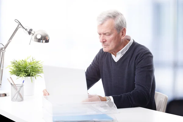 Businessman sitting at office — Stock Photo, Image